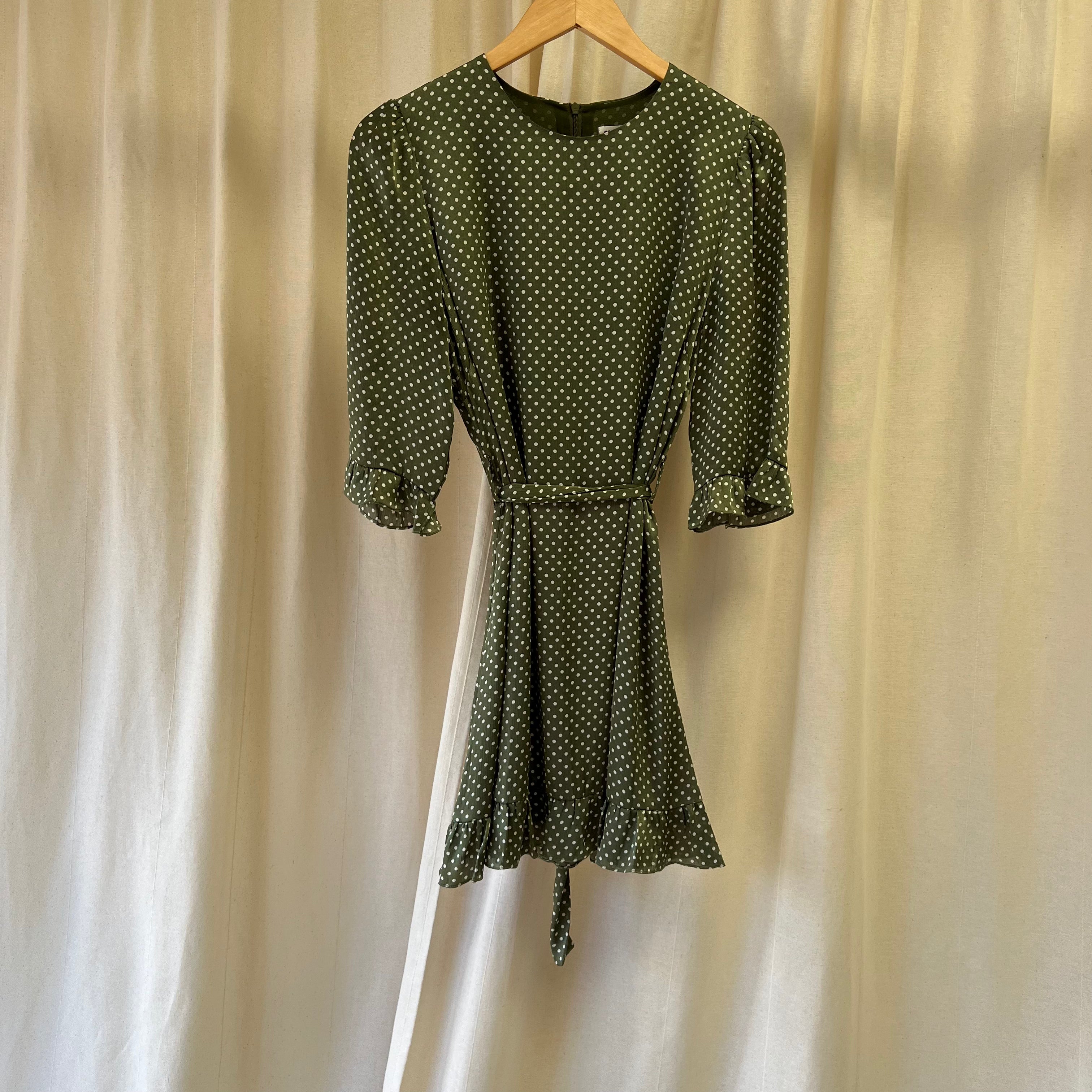 Sisterhood short dress with ruffle hem in green and white polka dot