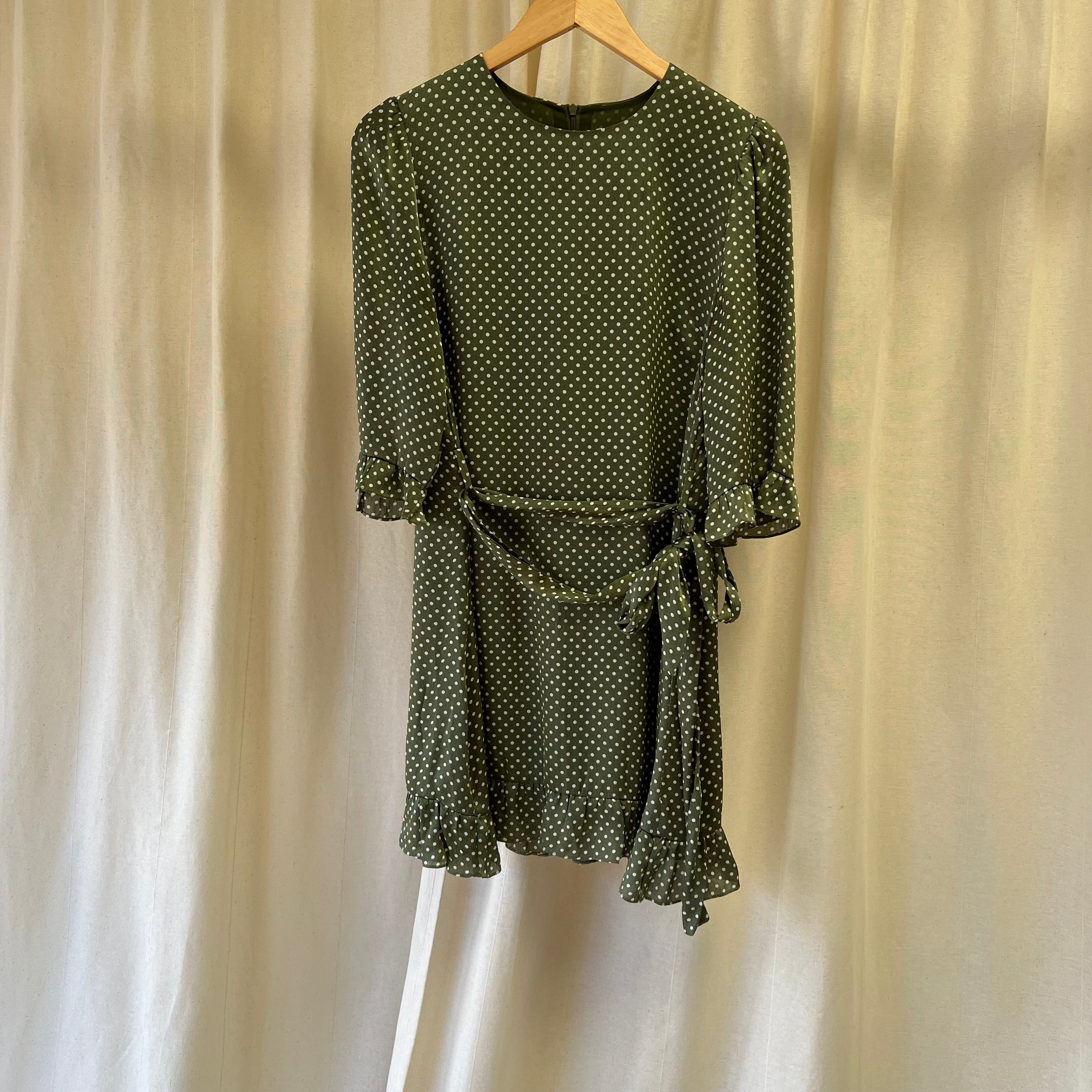 Sisterhood short dress with ruffle hem in green and white polka dot