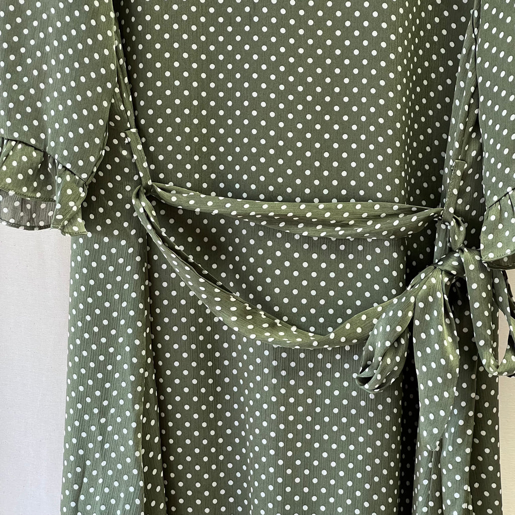 Sisterhood short dress with ruffle hem in green and white polka dot