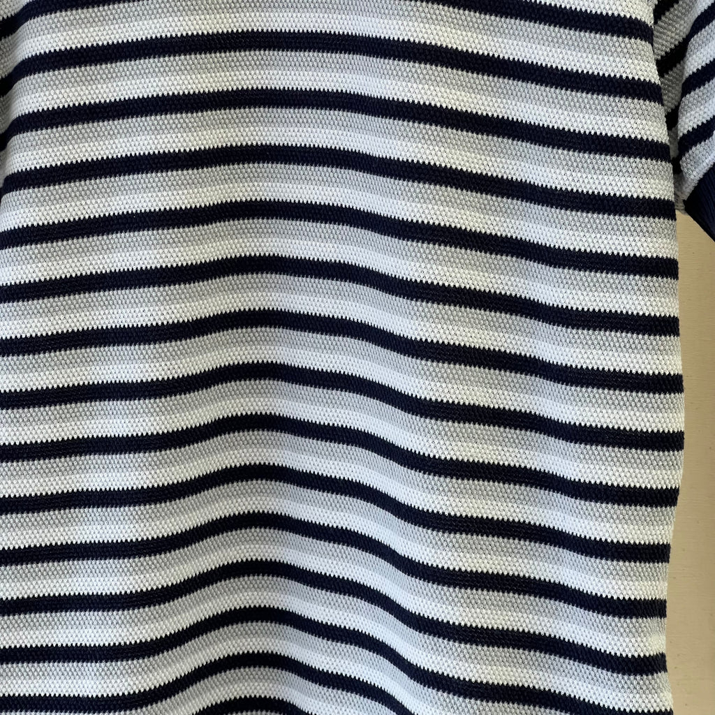 Close-up of a striped fabric with black and white horizontal stripes.