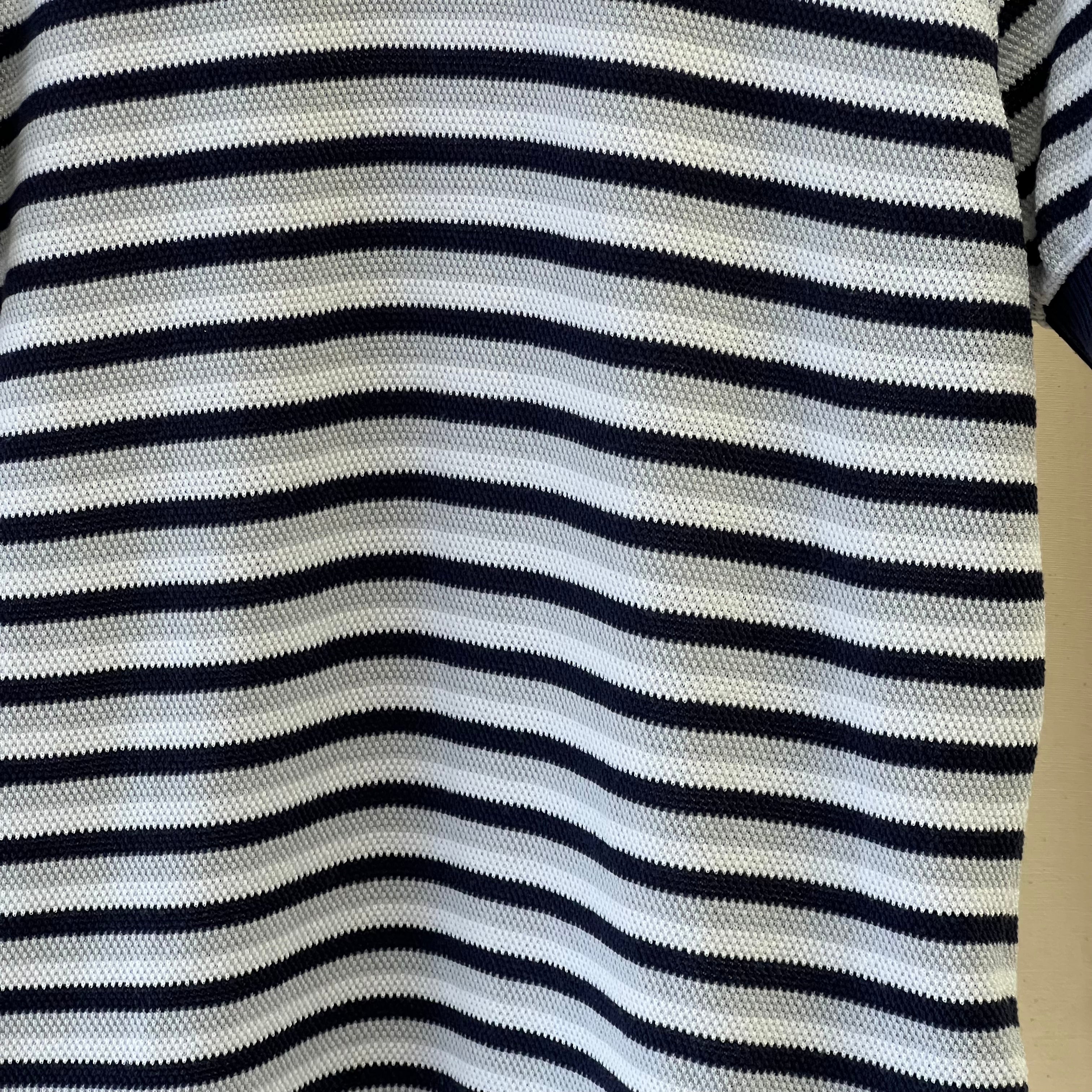 Close-up of a striped fabric with black and white horizontal stripes.