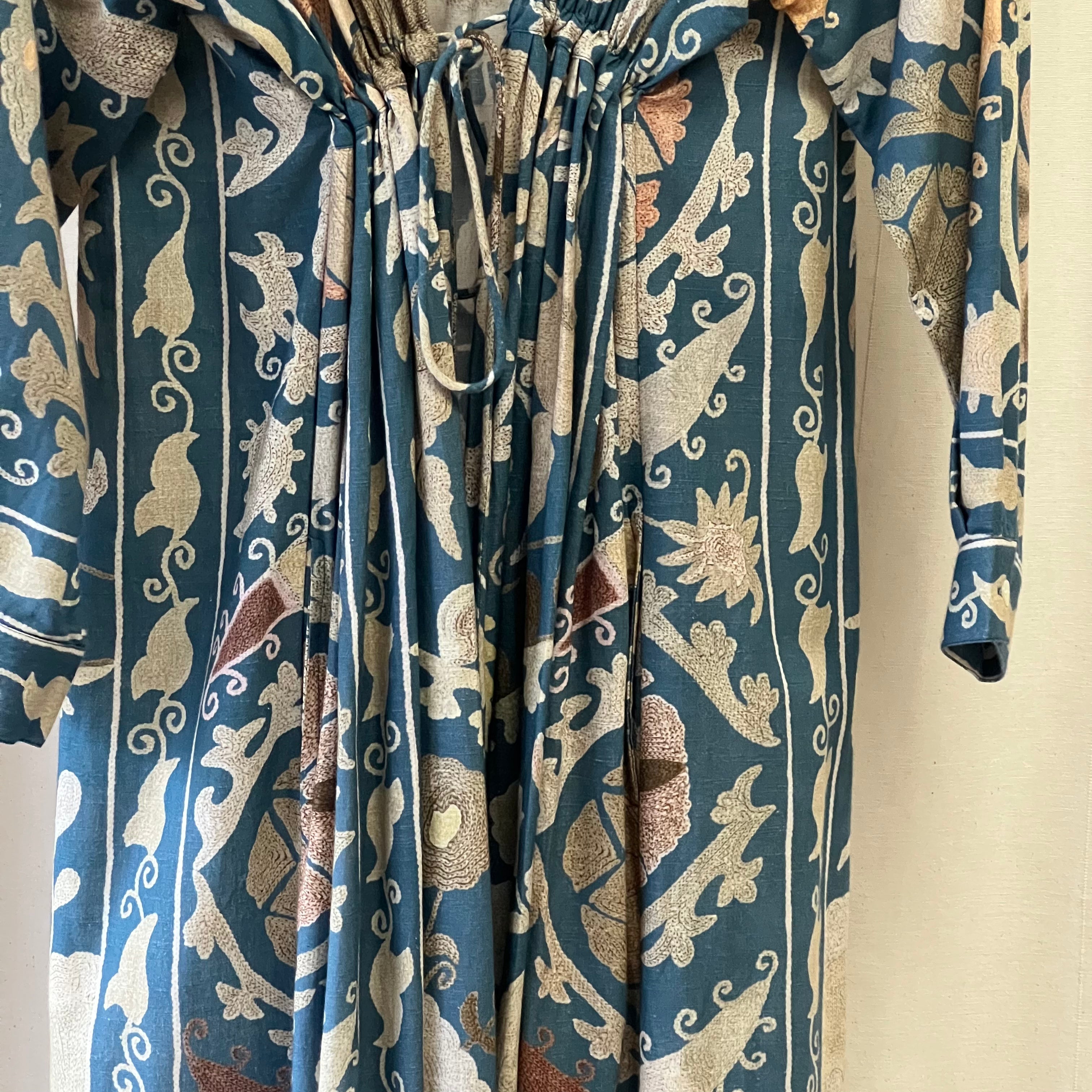 Patterned fabric with blue and beige design on a plain background