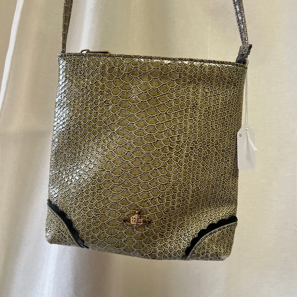 Snakeskin textured handbag with a visible brand logo on a white background